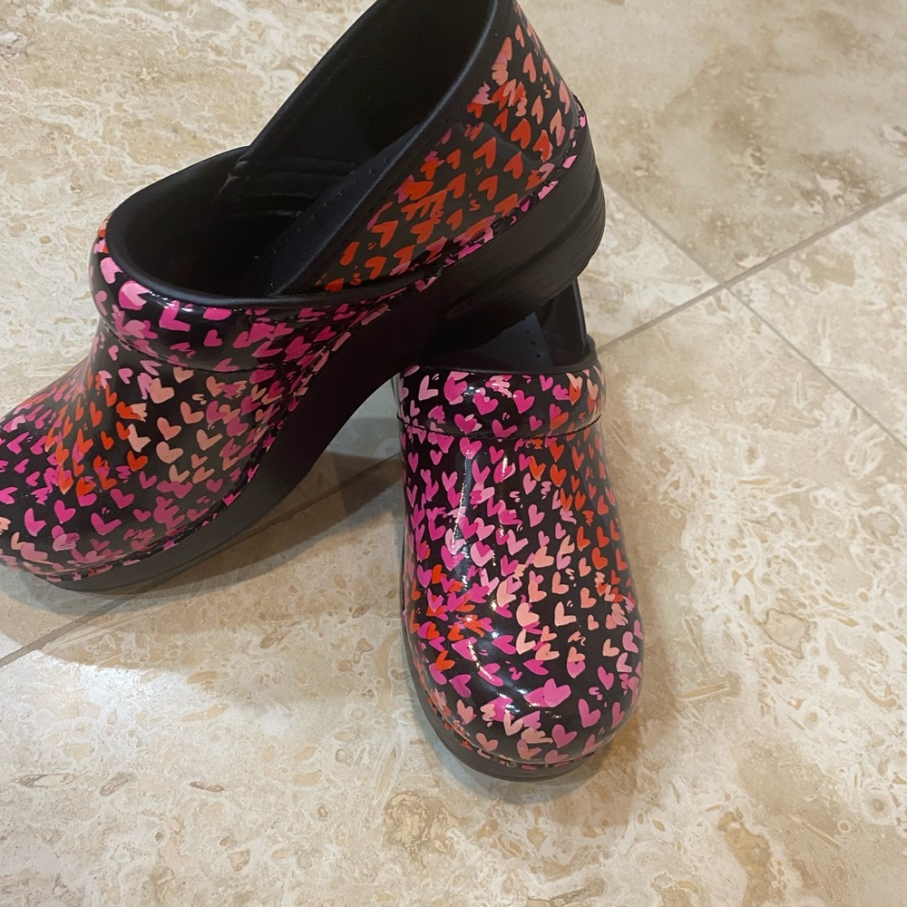 Dansko heart nursing clogs.